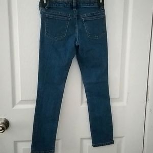 Girls lightly distressed dark denim jeans size 8